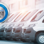 A row of white cargo vans with the 2023 FleetNews Reader Recommended 2023 logo